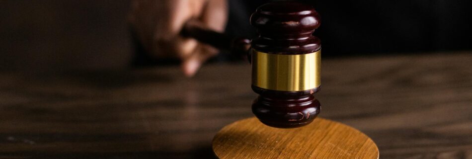 brown wooden gavel on brown wooden table