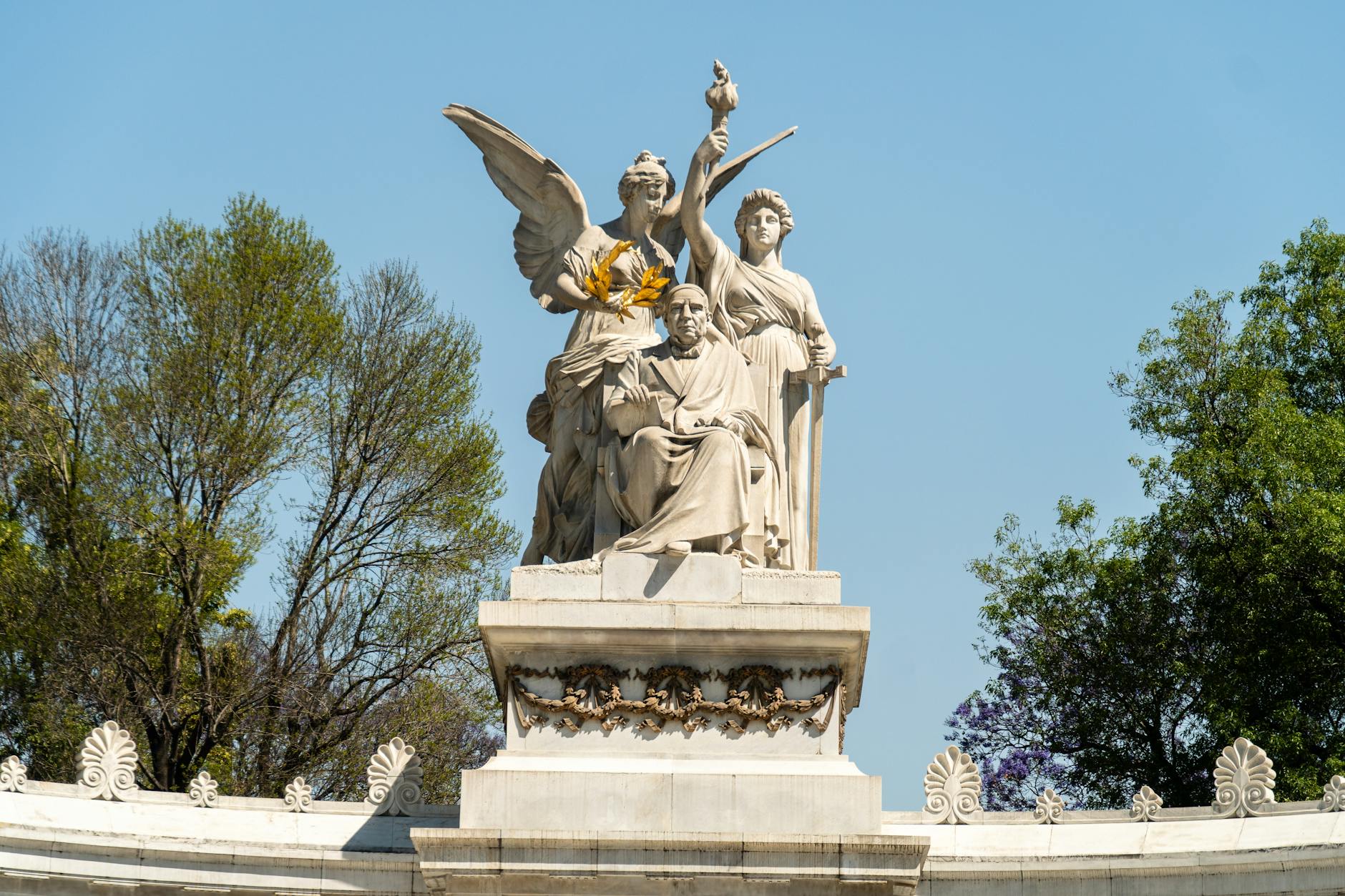 view of the statue on the benito juarez hemicycle monument in mexico city mexico